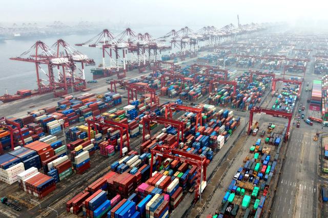 Cargo containers are seen at a port in Qingdao, eastern China's Shandong province on March 3, 2026. (Photo by CN-STR / AFP) / China OUT