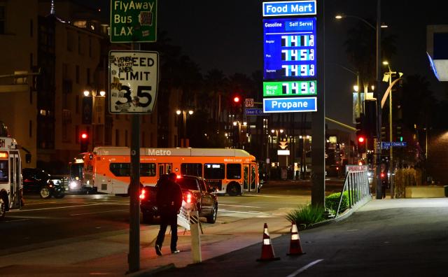 A sign with current gas prices is displayed at a gas station in Los Angeles, California on March 2, 2026. Energy prices surged on March 2 as the war in the Middle East led to outages of key energy production operations. In parallel, energy markets are also absorbing a de facto halt to traffic in the Strait of Hormuz, through which about 20 percent of global supply of oil and liquid natural gas travel.

The waterway has not technically been closed, but major maritime companies have suspended travel through it as insurance costs soar amid heightened risk. (Photo by Frederic J. BROWN / AFP)