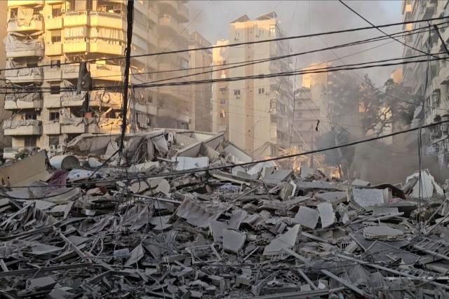 This frame grab from AFPTV video footage taken on March 3, 2026 shows rubble from buildings damaged after an early morning Israeli strike on Beirut's southern suburbs. The Israeli military issued new evacuation orders for dozens of locations in Lebanon on March 3, including warning residents in two southern Beirut neighbourhoods to stay away from several buildings ahead of an imminent operation. (Photo by AFPTV / AFP)