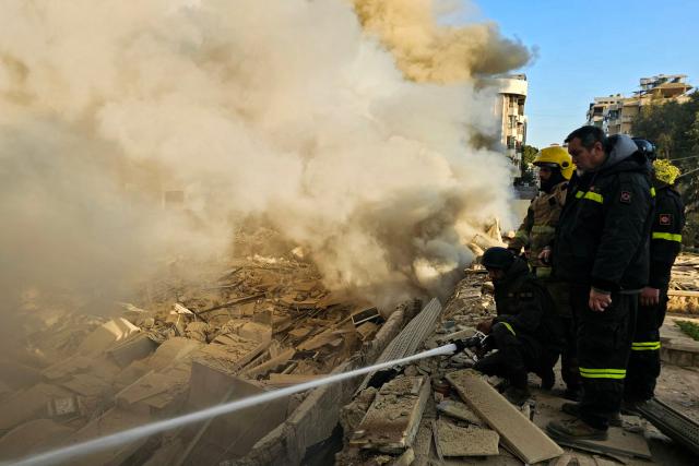 Firefighters extinguish fires at the site of an Israeli airstrike on the southern suburbs of Beirut on March 3, 2026. The Israeli military issued new evacuation orders for dozens of locations in Lebanon on March 3, including warning residents in two southern Beirut neighbourhoods to stay away from several buildings ahead of an imminent operation. (Photo by AFP)