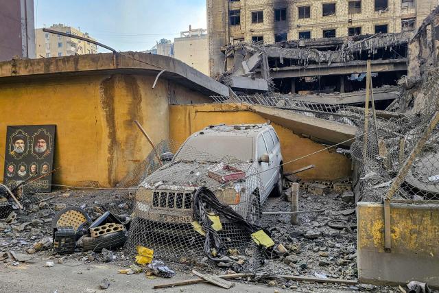 A destroyed vehicle outside the heavily-damaged building of the Lebanese Shiite movement Hezbollah's television station al-Manar, which was hit by overnight Israeli strikes, is pictured in Beirut's southern suburbs on March 3, 2026. Israel bombarded Lebanon on March 2, expanding the conflict across the region after the massive Israel-US attack on Iran that the US president launched to topple Tehran's ruling clerics, and killing their supreme leader o February 28. (Photo by AFP)