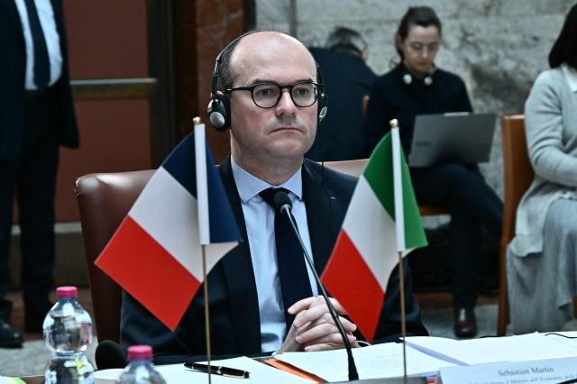 France's junior Minister for industry Sebastien Martin listens to the Minister of Enterprises and Made in Italy Adolfo Urso during a meeting at the Ministry of Enterprises and Made in Italy in Rome on March 3, 2026. (Photo by Filippo MONTEFORTE / AFP)
