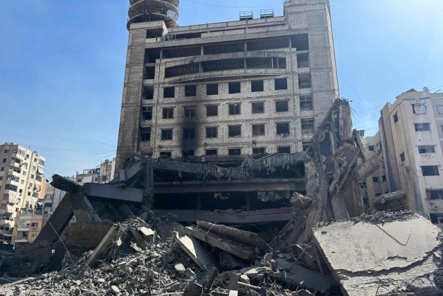 The heavily damaged building of the Lebanese Shiite movement Hezbollah’s television station al-Manar, which was hit by overnight Israeli strikes, is pictured in the southern suburbs of Beirut on March 3, 2026. The war launched by the United States and Israel against Iran spread across the Middle East, threatening to plunge the global economy into chaos, with Lebanon and Gulf energy exporters dragged into the conflict. (Photo by AFP stringer / AFP)