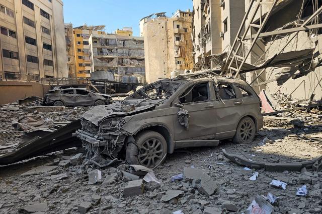 Damaged cars are pictured at a site of an Israeli airstrike in the southern suburbs of Beirut on March 3, 2026. The war launched by the United States and Israel against Iran spread across the Middle East, threatening to plunge the global economy into chaos, with Lebanon and Gulf energy exporters dragged into the conflict. (Photo by AFP)