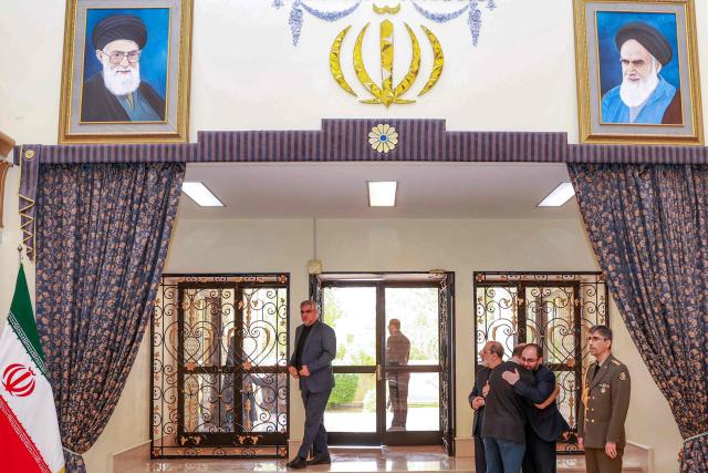 Mourners arrive to pay their respects for Iran's slain supreme leader Ali Khamenei, who was was killed in a joint US-Israeli strike on Tehran on February 28, during a memorial service at the Iranian embassy headquarters in Oman's capital Muscat on March 3, 2026. The United States and Israel launched strikes against Iran on February 28, killing Iran's supreme leader and top military leaders, prompting authorities to retaliate with strikes on Israel and US bases across the Gulf. (Photo by Haitham AL-SHUKAIRI / AFP)