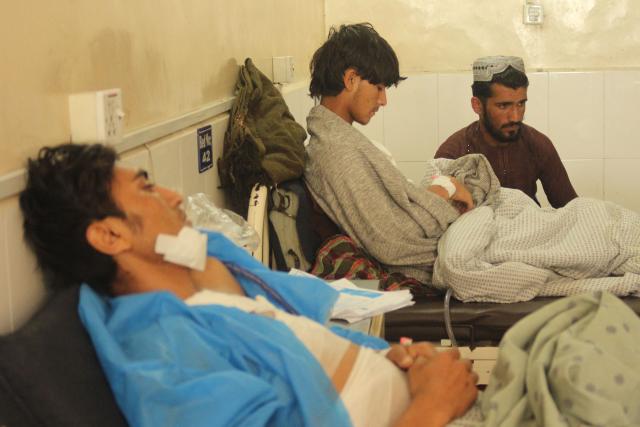 Wounded Afghan men receive medical treatment at a hospital in Jalalabad on March 3, 2026 amid ongoing cross-border conflict between Pakistan and Afghanistan. More than 8,000 Afghans have been forced from their homes by fighting with Pakistani forces along the border in recent days, the Taliban government said on March 3. (Photo by AFP)