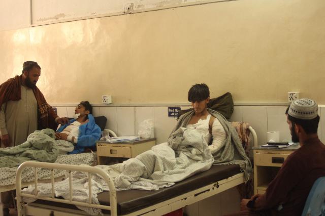 Wounded Afghan men receive medical treatment at a hospital in Jalalabad on March 3, 2026 amid ongoing cross-border conflict between Pakistan and Afghanistan. More than 8,000 Afghans have been forced from their homes by fighting with Pakistani forces along the border in recent days, the Taliban government said on March 3. (Photo by AFP)