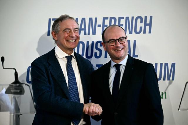 Italy's Minister of Enterprises and Made in Italy Adolfo Urso (L) shakes hands with France’s junior Minister for industry Sebastien Martin after their press conference in Rome on March 3, 2026. (Photo by Filippo MONTEFORTE / AFP)