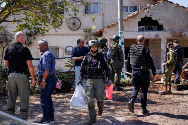Israeli army and security forces conduct a search sweep of a house that was hit by Hezbollah projectiles in Moshav Kfar Yuval in northern Israel near the border with southern Lebanon on March 3, 2026. Israel on March 3 ordered the military to take control of more positions in Lebanon, where the army pulled back some of its forces after Hezbollah attacked Israeli bases in support of its backer, Iran. (Photo by Jalaa MAREY / AFP)