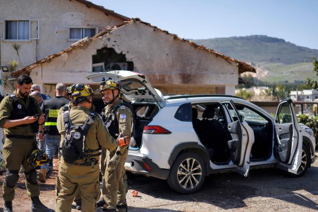 Israeli army and security forces conduct a search sweep of a house that was hit by Hezbollah projectiles in Moshav Kfar Yuval in northern Israel near the border with southern Lebanon on March 3, 2026. Israel on March 3 ordered the military to take control of more positions in Lebanon, where the army pulled back some of its forces after Hezbollah attacked Israeli bases in support of its backer, Iran. (Photo by Jalaa MAREY / AFP)