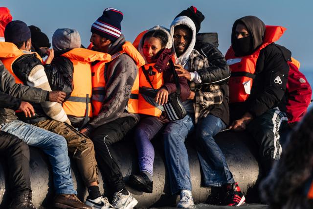 Migrants try to board a smugglers' boat in an attempt to cross the English Channel off the beach of Gravelines, northern France, on March 3, 2026. At dawn on March 3, 2026, four makeshift boats left the beach at Gravelines, each carrying at least around fifty people, taking advantage of the temporary improvement in weather conditions to attempt an illegal crossing of the English Channel, AFP journalists observed. (Photo by Sameer Al-DOUMY / AFP)