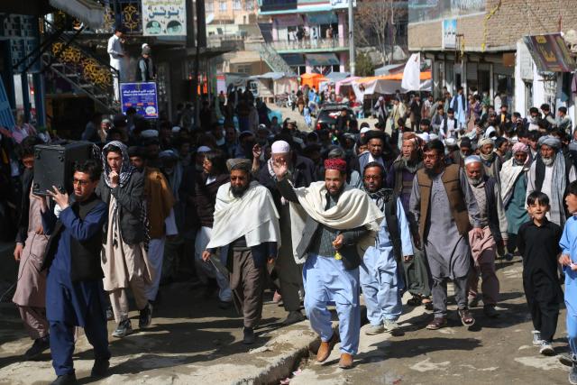 Afghans march through a market to show their solidarity for the Taliban, in Ghazni on March 3, 2026 amid ongoing cross-border conflict between Pakistan and Afghanistan. More than 8,000 Afghans have been forced from their homes by fighting with Pakistani forces along the border in recent days, the Taliban government said on March 3. (Photo by AFP)