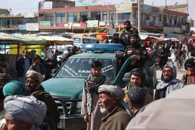 Afghans march through a market to show their solidarity for the Taliban, in Ghazni on March 3, 2026 amid ongoing cross-border conflict between Pakistan and Afghanistan. More than 8,000 Afghans have been forced from their homes by fighting with Pakistani forces along the border in recent days, the Taliban government said on March 3. (Photo by AFP)
