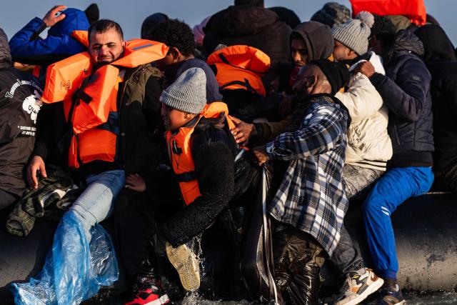 Migrants try to board a smugglers' boat in an attempt to cross the English Channel off the beach of Gravelines, northern France, on March 3, 2026. At dawn on March 3, 2026, four makeshift boats left the beach at Gravelines, each carrying at least around fifty people, taking advantage of the temporary improvement in weather conditions to attempt an illegal crossing of the English Channel, AFP journalists observed. (Photo by Sameer Al-DOUMY / AFP)