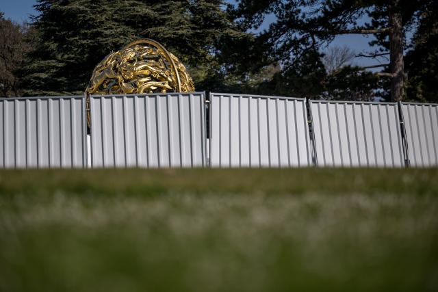 This photograph shows protections around the Celestial Sphere, known also as the Woodrow Wilson Memorial Sphere, as it is undergoing renovation at the "Palais des Nations" building which houses the United Nations Offices in Geneva on March 3, 2026. The United Nations Office at Geneva has embarked on a full renovation of its historic headquarters combined with the construction of new buildings. (Photo by Fabrice COFFRINI / AFP)