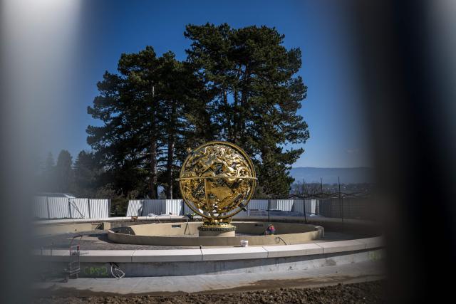 This photograph shows protections around the Celestial Sphere, known also as the Woodrow Wilson Memorial Sphere, as it is undergoing renovation at the "Palais des Nations" building which houses the United Nations Offices in Geneva on March 3, 2026. The United Nations Office at Geneva has embarked on a full renovation of its historic headquarters combined with the construction of new buildings. (Photo by Fabrice COFFRINI / AFP)