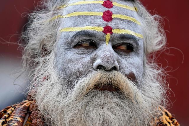 A Hindu holy man looks on at the Pashupatinath temple in Kathmandu on March 3, 2026 ahead of Nepal's parliamentary elections. (Photo by TAUSEEF MUSTAFA / AFP)