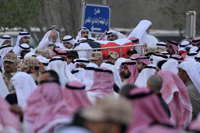 Mourners carry the flag draped body of a Kuwait Army members who were killed in an Iranian strike on Kuwait at the Sulaibikhat cemetery, west of Kuwait City on March 3, 2026. The United States and Israel launched strikes against Iran on February 28, with the killing of Iran's supreme leader and the Islamic republic retaliated with barrages of missiles at Gulf states and Israel. (Photo by YASSER AL-ZAYYAT / AFP)