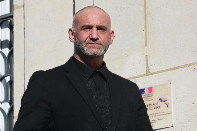 Christophe Ellul looks on as he left the courthouse in Soissons, northern France, on March 3, 2026 during the opening of his trial on charges of the murder of his wife Elisa Pilarski who was bitten to death by his dog in 2019. Christophe Ellul, 51, is on trial until on March 5, 2026 for manslaughter. On November 16, 2019, he let his partner, 29 years old and six months pregnant, go alone into the woods to walk Curtis, his partners dog, even though he posed a danger to her, according to the investigation. (Photo by Francois LO PRESTI / AFP)