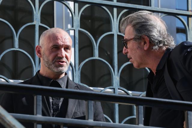 Christophe Ellul speaks with his lawyer Alexandre Novion as they arrive at the courthouse in Soissons, northern France, on March 3, 2026 during the opening of his trial on charges of the murder of his wife Elisa Pilarski who was bitten to death by his dog in 2019. Christophe Ellul, 51, is on trial until on March 5, 2026 for manslaughter. On November 16, 2019, he let his partner, 29 years old and six months pregnant, go alone into the woods to walk Curtis, his partners dog, even though he posed a danger to her, according to the investigation. (Photo by Francois LO PRESTI / AFP)