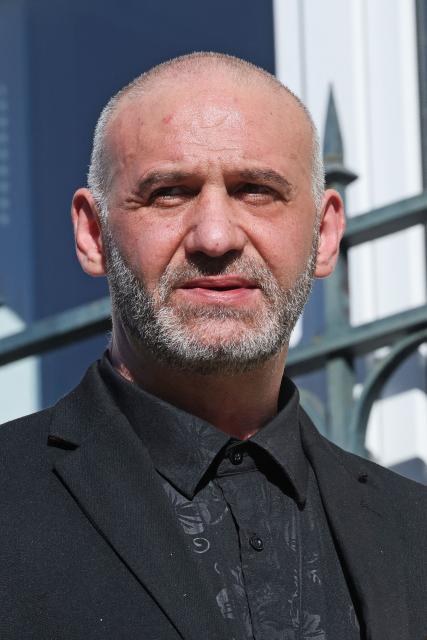Christophe Ellul looks on as he left the courthouse in Soissons, northern France, on March 3, 2026 during the opening of his trial on charges of the murder of his wife Elisa Pilarski who was bitten to death by his dog in 2019. Christophe Ellul, 51, is on trial until on March 5, 2026 for manslaughter. On November 16, 2019, he let his partner, 29 years old and six months pregnant, go alone into the woods to walk Curtis, his partners dog, even though he posed a danger to her, according to the investigation. (Photo by Francois LO PRESTI / AFP)
