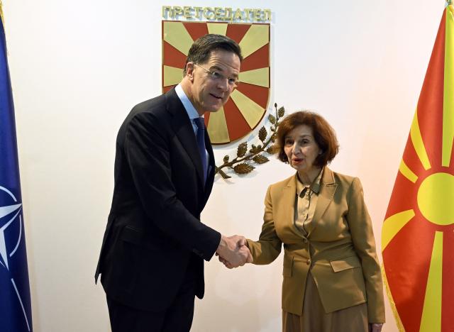 NATO Secretary General Mark Rutte (L) shakes hands with North Macedonia's President Gordana Siljanovska-Davkova at the Presidential office in Skopje on March 3, 2026. (Photo by Robert ATANASOVSKI / AFP)