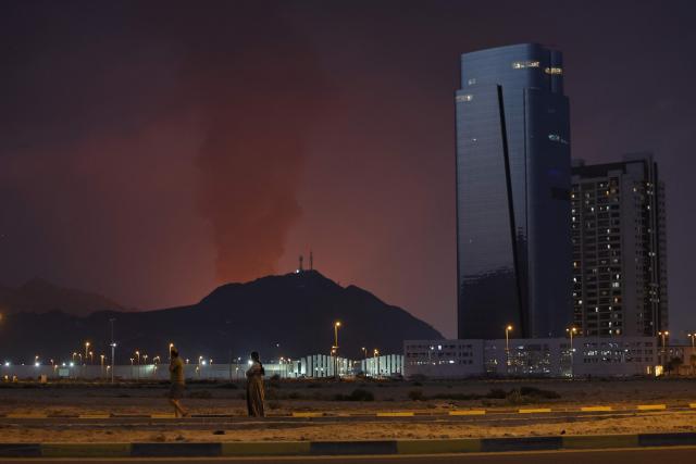 A tall plume of black smoke ascends following an explosion in the Fujairah industrial zone on March 3, 2026. Iran's strikes on Gulf neighbours since February 28, following the US-Israeli attack, forced the UAE to shut its airspace, blindsiding travellers who thought they were headed to one of the region's safest holiday destinations. (Photo by Fadel SENNA / AFP)