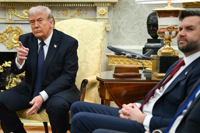 US Vice President JD Vance (R) looks on as US President Donald Trump speaks during a meeting with German Chancellor Friedrich Merz in the Oval Office of the White House in Washington, DC on March 3, 2026. Chancellor Merz is the first European leader to visit President Trump since the United States and Israel launched their war against Iran. (Photo by ANDREW CABALLERO-REYNOLDS / AFP)