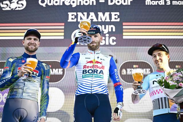 (From L) Second-placed Soudal Quick-Step's Belgian Laurenz Rex, winner Red Bull-BORA-hansgrohe's Belgian Jordi Meeus and NSN Cycling Team's French Hugo Hofstetter celebrate on the podium after the 'Ename Samyn Classic' one day cycling race, 203,8km from Quaregnon to Dour on March 3, 2026. (Photo by JASPER JACOBS / Belga / AFP) / Belgium OUT