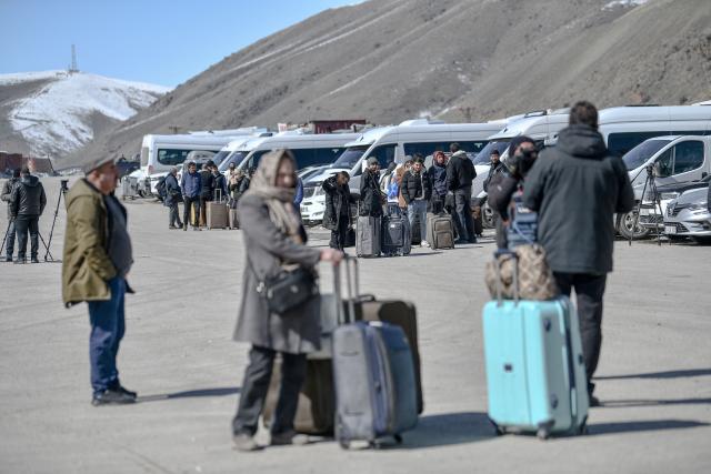 Iranian nationals arrive in Turkey after passing through the Razi-Kapiköy border crossing in Van, north-eastern Turkey, on March 3, 2026, a day after Turkey and Iran have mutually suspended day-trip crossings at their border as Israeli-US strikes continued to pound the Islamic Republic. (Photo by Ali IHSAN OZTURK / AFP)