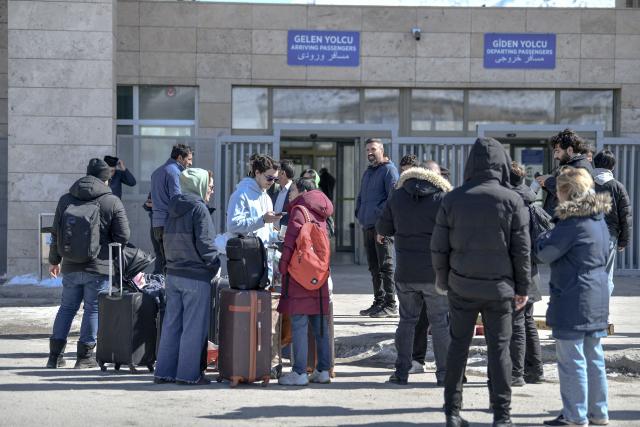 Iranian nationals arrive in Turkey after passing through the Razi-Kapiköy border crossing in Van, north-eastern Turkey, on March 3, 2026, a day after Turkey and Iran have mutually suspended day-trip crossings at their border as Israeli-US strikes continued to pound the Islamic Republic. (Photo by Ali IHSAN OZTURK / AFP)