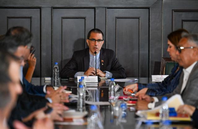 The President of the Parliamentary Amnesty Commission Jorge Arreaza (C) speaks during a meeting of the Amnesty Commission with members of the justice system at the National Assembly headquarters in Caracas on March 3, 2026. (Photo by Juan BARRETO / AFP)