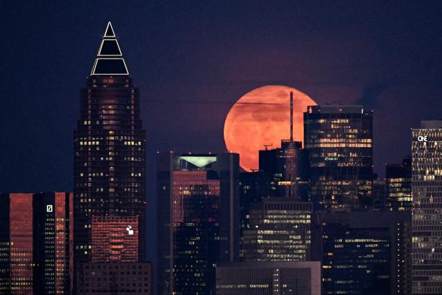 The March full moon, also known as "Worm Moon" rises over banking district in Frankfurt am Main, western Germany on March 3, 2026. (Photo by Kirill KUDRYAVTSEV / AFP)