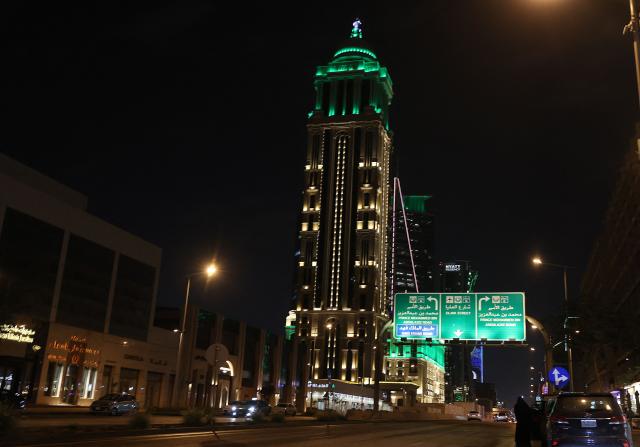 Vehciles drive past skyscrapers along the Olaya Road in the Saudi capital Riyadh on March 3, 2026. The United States and Israel launched strikes against Iran on February 28, killing Iran's supreme leader and top military leaders, prompting authorities to retaliate with strikes on Israel and across the Gulf. (Photo by Fayez Nureldine / AFP)