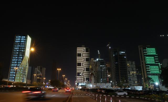 Vehciles drive past skyscrapers along the King Fahad road, a principal transport arteries that links the city's southern and northern districts, in the Saudi capital Riyadh on March 3, 2026. The United States and Israel launched strikes against Iran on February 28, killing Iran's supreme leader and top military leaders, prompting authorities to retaliate with strikes on Israel and across the Gulf. (Photo by Fayez Nureldine / AFP)