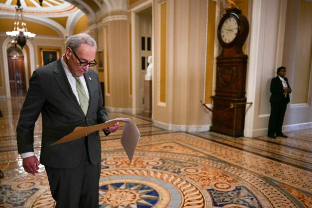 US Senate Minority Leader Chuck Schumer, Democrat from New York, looks over note before speaking to the press following a closed-door lunch meeting with Senate Democrats at the US Capitol in Washington, DC, on March 3, 2026. US Secretary of State Marco Rubio and Defense Secretary Pete Hegseth are scheduled to brief House and Senate members on US military action in Iran later in the day on Tuesday. (Photo by Jim WATSON / AFP)