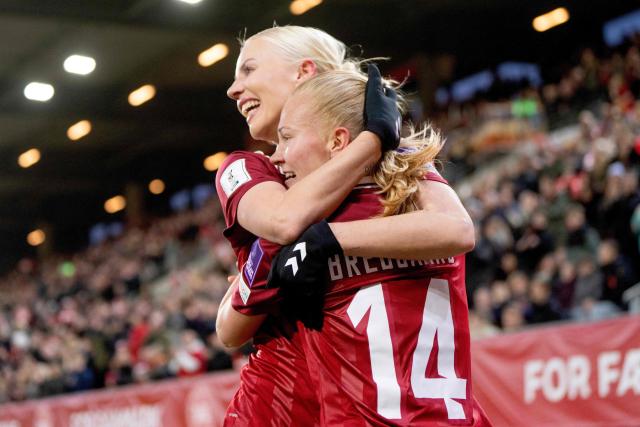 Denmark's midfielder #14 Sofie Bredgaard celebrates scoring the opening goal with her teammate Sofia Svava during the Women's World Cup 2027 Europe Zone Qualifiers football match Denmark vs Serbia at Horsens Stadium on March 3, 2026. (Photo by Bo Amstrup / Ritzau Scanpix / AFP) / Denmark OUT