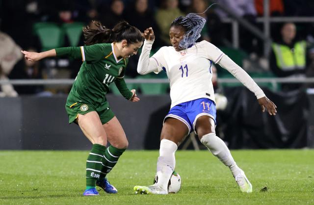 Ireland's midfielder #14 Marissa Sheva (L) challenges France's forward #11 Kadidiatou Diani  during Women's World Cup 2027 Group A2 Qualifier football match between Ireland and France at Tallaght Stadium in Ireland on March 3, 2026. (Photo by Paul Faith / AFP)