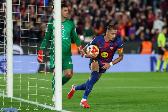 Barcelona's Brazilian forward #11 Raphinha celebrates scoring his team's second goal during the Copa del Rey (King's Cup) semi final second leg football match between FC Barcelona and Club Atletico de Madrid at Camp Nou Stadium in Barcelona on March 3, 2026. (Photo by Lluis GENE / AFP)