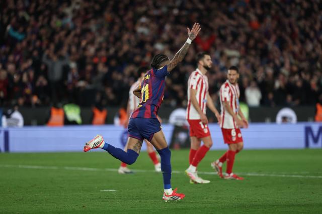Barcelona's Brazilian forward #11 Raphinha celebrates scoring his team's second goal during the Copa del Rey (King's Cup) semi final second leg football match between FC Barcelona and Club Atletico de Madrid at Camp Nou Stadium in Barcelona on March 3, 2026. (Photo by Lluis GENE / AFP)