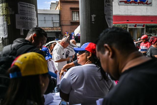 Relatives of political prisoners gather in front of the judicial court offices in Caracas on March 3, 2026. (Photo by Juan BARRETO / AFP)