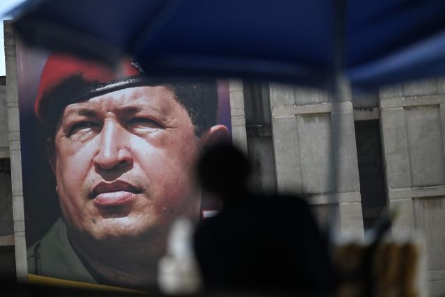 A banner of former Venezuelan president Hugo Chavez is seen in Caracas on March 3, 2026. (Photo by Juan BARRETO / AFP)