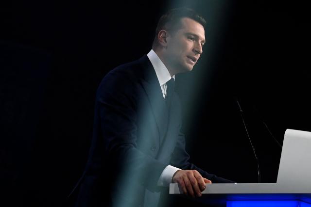 President of French far-right party Rassemblement National (RN) Jordan Bardella addresses the audience at a campaign meeting to support National Rally (RN)'s Nimes mayoral candidate Julien Sanchez, ahead of France's upcoming municipal elections in Nimes, southern France on March 3, 2026. French voters head to the polls for municipal elections on March 15 and 22, 2026. (Photo by Sylvain THOMAS / AFP)