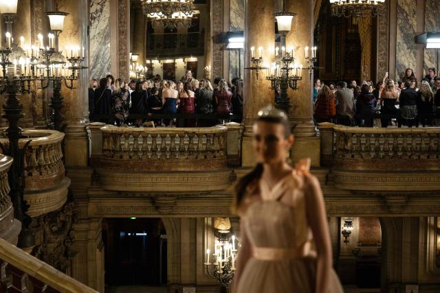 A guest poses for a photograph as she arrives for a Women's Ready to Wear Fall/Winter 2026-2027 collection fashion show as part of the Paris Women Fashion Week, at the Palais Garnier, in Paris, on March 3, 2026. (Photo by Blanca CRUZ / AFP)