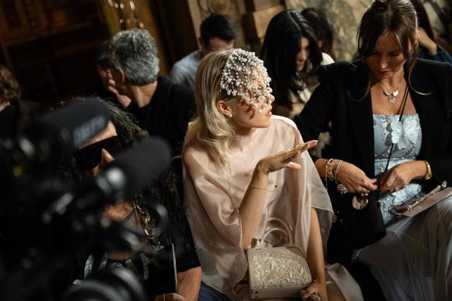 A guest wears a pearl headpiece as she arrive for a Women's Ready to Wear Fall/Winter 2026-2027 collection fashion show as part of the Paris Women Fashion Week, at the Palais Garnier, in Paris, on March 3, 2026. (Photo by Blanca CRUZ / AFP)