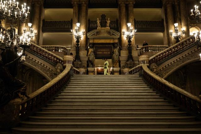 A guest walks at the Palais Garnier as he leaves a Women's Ready to Wear Fall/Winter 2026-2027 collection fashion show as part of the Paris Women Fashion Week, at the Palais Garnier, in Paris, on March 3, 2026. (Photo by Blanca CRUZ / AFP)