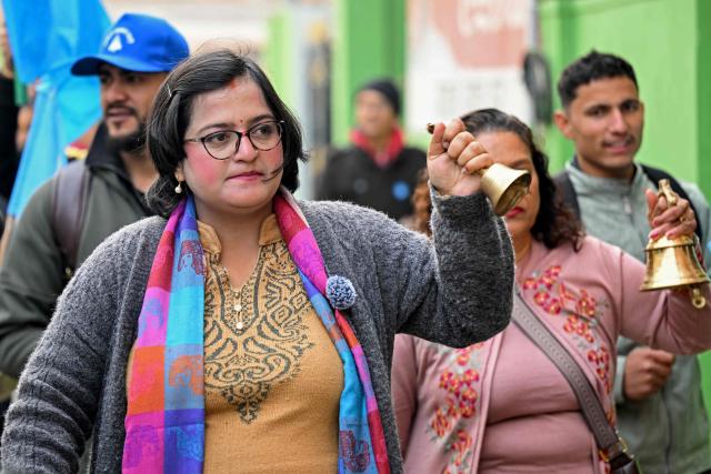 This photograph taken on February 13, 2026 shows Rastriya Swatantra Party (RSP) election candidate Ranju Darshana (C) taking part in a door-to-door campaign with her party workers ahead of Nepal's general election in Kathmandu. Nepali women risked their lives in the September 2025 deadly anti-corruption protests that toppled the government. But when the country votes on March 5, they will be largely absent from the ballot as candidates. Darshana, while heavily pregnant is among the few women running  that make up only 10 percent of more than 3,400 candidates in the direct vote. (Photo by Prakash MATHEMA / AFP) / TO GO WITH 'Nepal-Politics-Election-Women' FOCUS