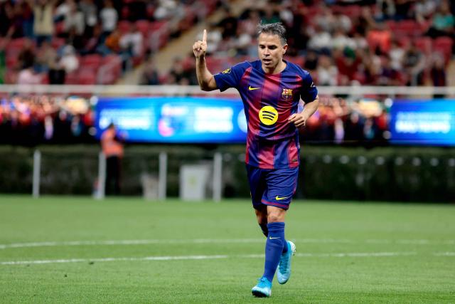 Barcelona's Argentine forward Javier Saviola celebrates scoring a goal during the exhibition friendly football match between Spain's Real Madrid Legends and Barcelona Legends at the Akron Stadium in Guadalajara, Mexico, on March 3, 2026. (Photo by Ulises Ruiz / AFP)