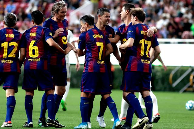 Barcelona's Argentine forward Javier Saviola (C) celebrates with teammates after scoring a goal during the exhibition friendly football match between Spain's Real Madrid Legends and Barcelona Legends at the Akron Stadium in Guadalajara, Mexico, on March 3, 2026. (Photo by Ulises Ruiz / AFP)