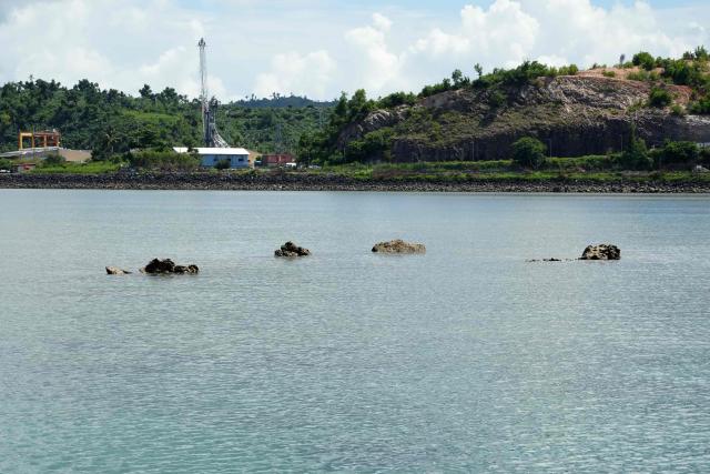 A coral reef damaged by cyclone Chido is seen at low tide in the northern part of Mayotte Lagoon, on the French Indian Ocean territory of Mayotte, on February 24, 2026. Cyclone Chido struck Mayotte in December 2024, adding to the effects of a heatwave that had already weakened the reefs earlier that year. Coral mortality ranges from 26 to 88 percent depending on the site, according to the Mayotte Marine Nature Park. (Photo by Marine GACHET / AFP)